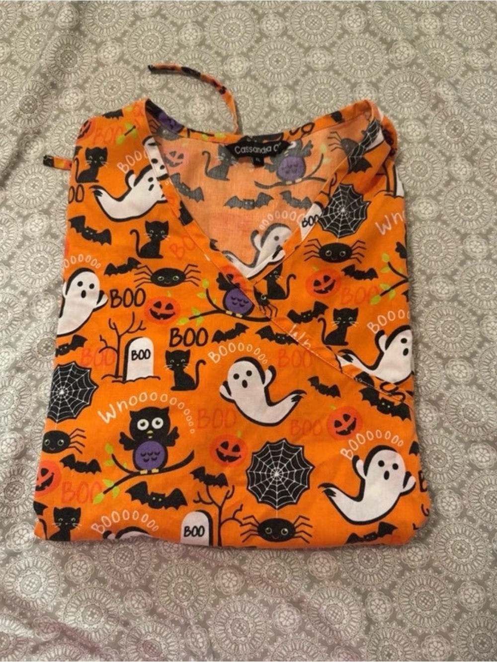 Cassandra C Women’s Orange Halloween Ghost & Spider scrub top
